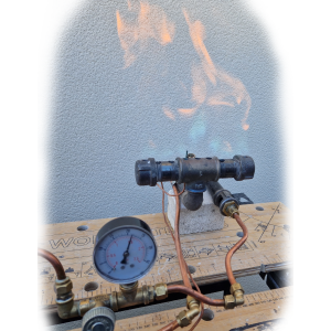 Image showing a gas burner being tested with presure gauge in foreground